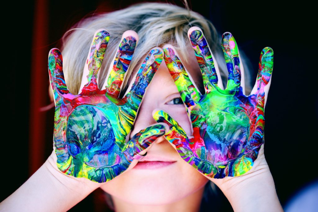 A child with colorful fingerpaints. Clemmons Family Law focuses on child custody issues. Photo by Sharon McCutcheon from Pexels