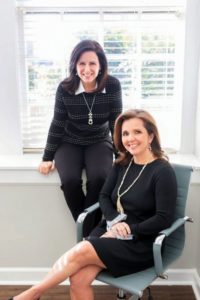 Kyla Sipprell and Holly M. Groce of Clemmons Family Law in their office